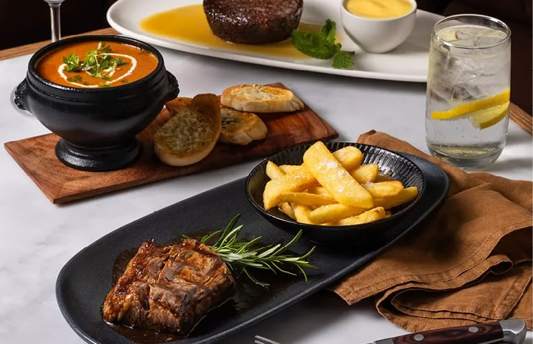A private dinner: soup, steak and chips