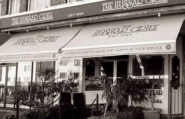 The Hussar Grill storefront with its awning, established 1964